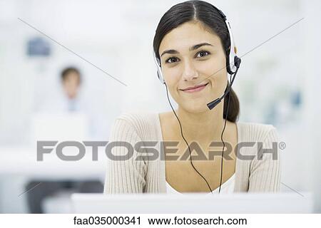 Young female telemarketer View Large Photo Image Stock Image - Young female telemarketer. Fotosearch