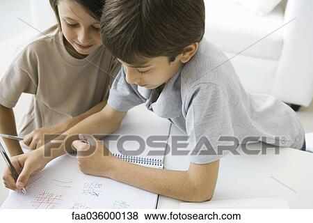 Brothers playing tic-tac-toe together View Large Photo Image Stock Photo - Brothers playing tic-tac-toe together. Fotosearch