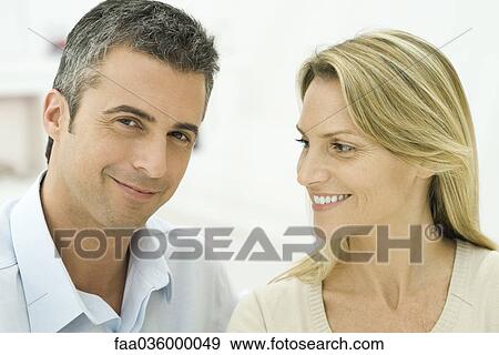 Couple together, smiling, man looking at camera View Large Photo Image Stock Photo - Couple together, smiling, man looking at camera. Fotosearch