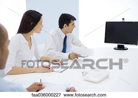 Group of executives having teleconference View Large Photo Image Stock Photo - Group of executives having teleconference. Fotosearch