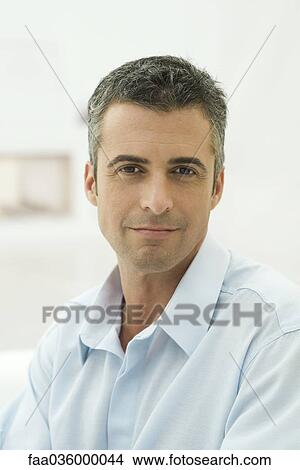 Man smiling at camera, portrait View Large Photo Image Picture - Man smiling at camera, portrait. Fotosearch