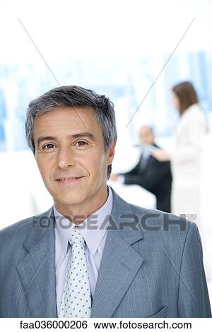 Mature businessman, smiling at camera, portrait View Large Photo Image Stock Photograph - Mature businessman, smiling at camera, portrait. Fotosearch