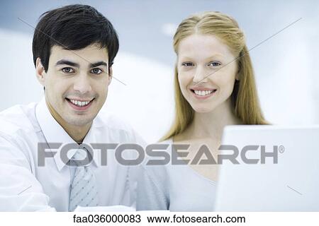 Professionals side by side smiling at camera, portrait View Large Photo Image Stock Image - Professionals side by side smiling at camera, portrait. Fotosearch