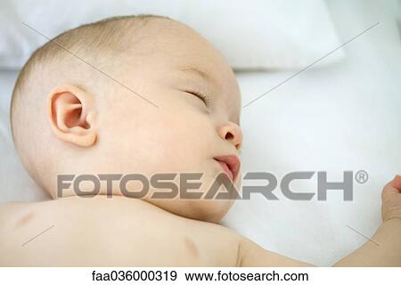 Stock Photo - Sleeping baby, close-up. Fotosearch