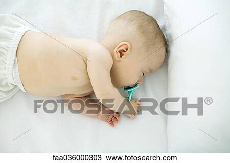 Sleeping baby, overhead view View Large Photo Image Stock Image - Sleeping baby, overhead view. Fotosearch