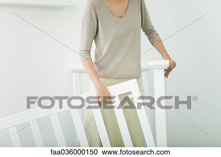 Woman assembling crib in nursery, cropped view View Large Photo Image Stock Image - Woman assembling crib in nursery, cropped view. Fotosearch