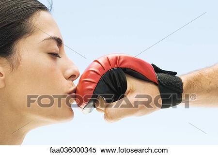 Woman kissing man's boxing glove, eyes closed, side view View Large Photo Image Stock Photography - Woman kissing man's boxing glove, eyes closed, side view. Fotosearch