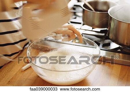 Stock Image - Beating egg whites. Fotosearch