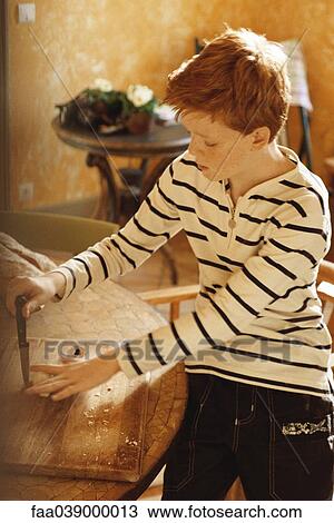Boy playing with knife on cutting board View Large Photo Image Stock Image - Boy playing with knife on cutting board. Fotosearch