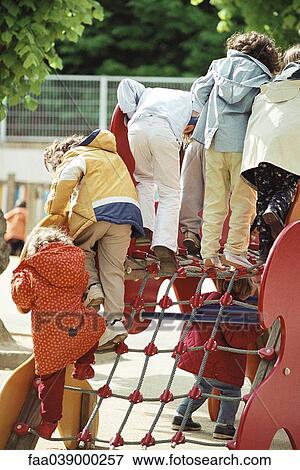 Children playing on playground equipment View Large Photo Image Stock Photo - Children playing on playground equipment. Fotosearch