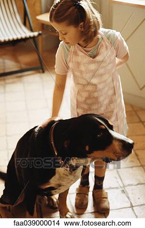 Picture - Girl petting dog. Fotosearch