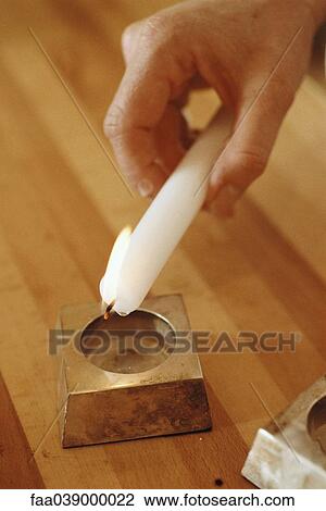Lit candle dripping wax into candle holder View Large Photo Image Stock Image - Lit candle dripping wax into candle holder. Fotosearch