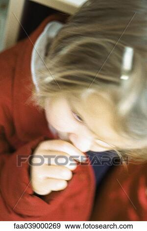 Stock Photo - Little girl sucking thumb, defocused. Fotosearch