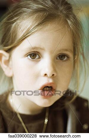 Little girl with mouth open, portrait View Large Photo Image Stock Photo - Little girl with mouth open, portrait. Fotosearch