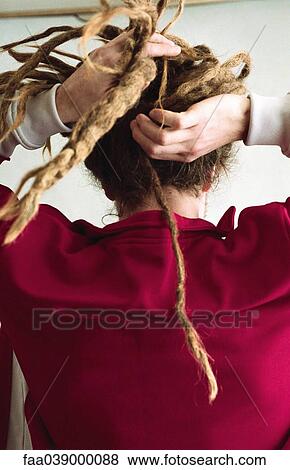Man braiding long dreadlocks, rear view View Large Photo Image Stock Photo - Man braiding long dreadlocks, rear view. Fotosearch