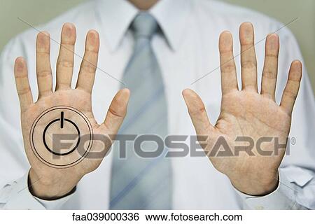 Stock Photograph - Man pressing power button. Fotosearch