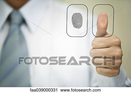 Stock Image - Man pressing thumb to fingerprint reader. Fotosearch