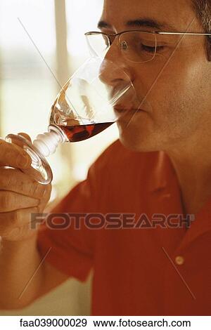 Man tasting red wine View Large Photo Image Stock Photo - Man tasting red wine. Fotosearch