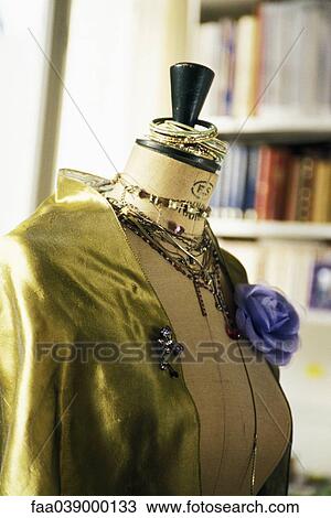Mannequin displaying satin blouse, jewelry View Large Photo Image Stock Image - Mannequin displaying satin blouse, jewelry. Fotosearch