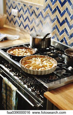 Stock Photograph - Pies on stove. Fotosearch