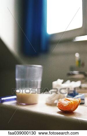 Quarter section of orange on kitchen counter, half glass of milk nearby View Large Photo Image Stock Image - Quarter section of orange on kitchen counter, half glass of milk nearby. Fotosearch