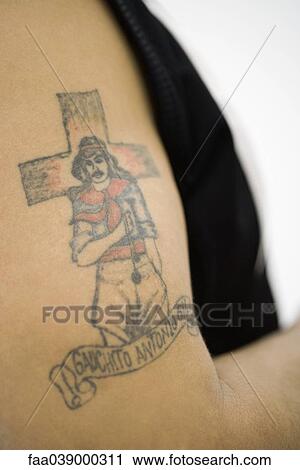 Tattoo of Gauchito Antonio Gil (Little Gaucho Gil) on man's bicep View Large Photo Image Stock Image - Tattoo of Gauchito Antonio Gil (Little Gaucho Gil) on man's bicep. Fotosearch