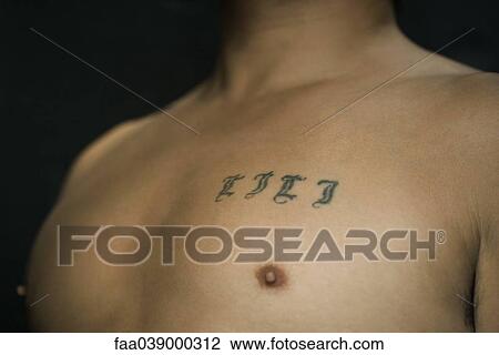 Tattooed letters on man's chest View Large Photo Image Stock Image - Tattooed letters on man's chest. Fotosearch