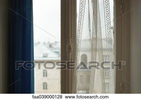 Stock Photo - Window with view of surrounding rooftops. Fotosearch