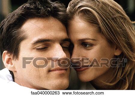 Couple cheek to cheek, smiling, man's eyes closed View Large Photo Image Stock Image - Couple cheek to cheek, smiling, man's eyes closed. Fotosearch