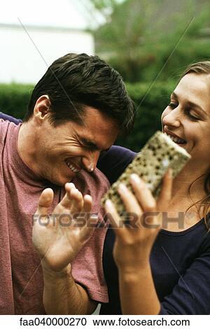 Couple play fighting with sponge View Large Photo Image Stock Image - Couple play fighting with sponge. Fotosearch