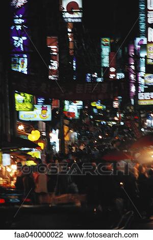 Crowded city street at night View Large Photo Image Stock Image - Crowded city street at night. Fotosearch