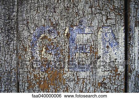 Stock Photograph - Flaking paint on wooden surface. Fotosearch