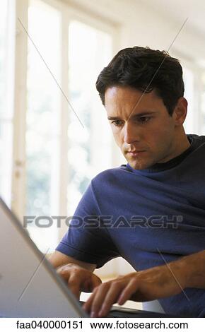 Man typing on laptop View Large Photo Image Stock Image - Man typing on laptop. Fotosearch
