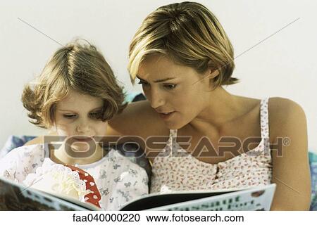 Mother and daughter reading book together View Large Photo Image Stock Image - Mother and daughter reading book together. Fotosearch