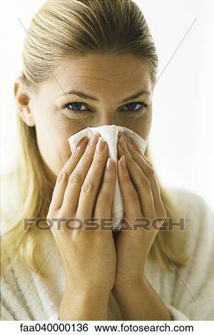 Stock Photograph - Woman blowing nose. Fotosearch