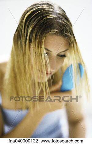 Woman brushing hair View Large Photo Image Stock Image - Woman brushing hair. Fotosearch