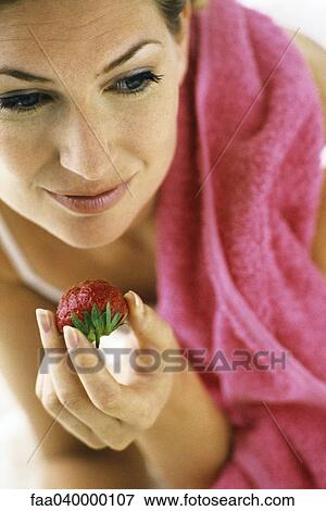 Woman eating strawberry View Large Photo Image Stock Photo - Woman eating strawberry. Fotosearch