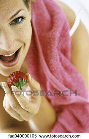 Woman eating strawberry View Large Photo Image Stock Photography - Woman eating strawberry. Fotosearch