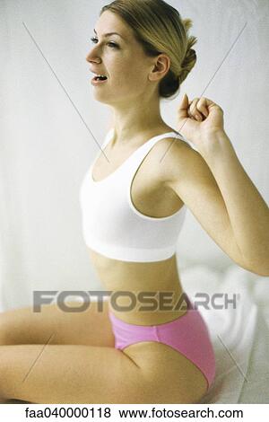 Woman in underwear, stretching View Large Photo Image Stock Photo - Woman in underwear, stretching. Fotosearch
