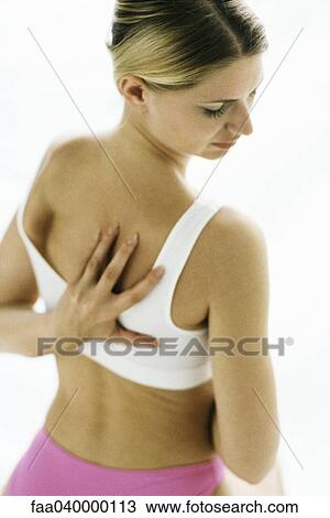 Woman in underwear, touching back View Large Photo Image Stock Image - Woman in underwear, touching back. Fotosearch