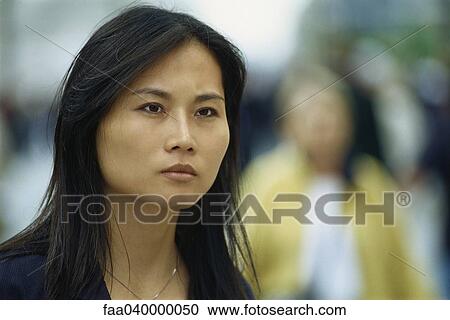 Woman looking away with brow furrowed View Large Photo Image Stock Image - Woman looking away with brow furrowed. Fotosearch