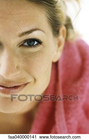 Woman smiling at camera, towel on shoulder View Large Photo Image Stock Image - Woman smiling at camera, towel on shoulder. Fotosearch