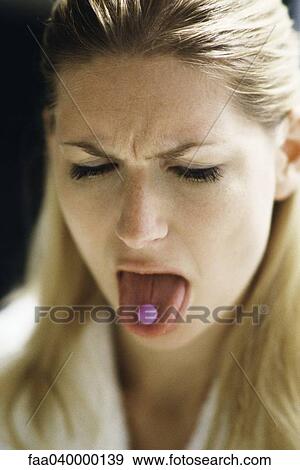 Woman sticking out tongue, showing pill View Large Photo Image Stock Photo - Woman sticking out tongue, showing pill. Fotosearch