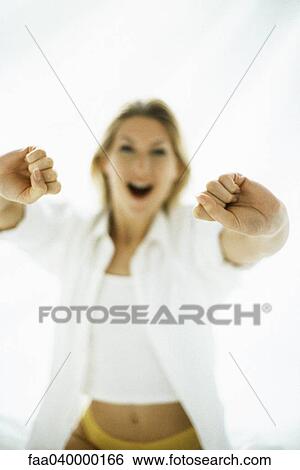 Woman stretching, focus on hands View Large Photo Image Stock Photograph - Woman stretching, focus on hands. Fotosearch