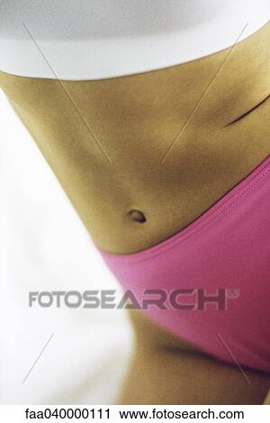 Woman stretching, mid-section View Large Photo Image Stock Image - Woman stretching, mid-section. Fotosearch