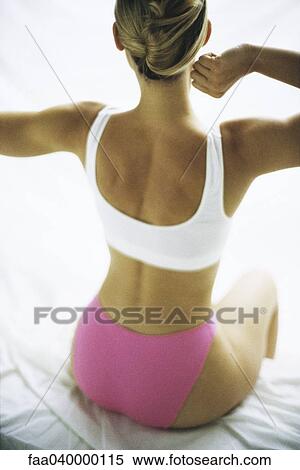 Woman stretching, rear view View Large Photo Image Stock Photography - Woman stretching, rear view. Fotosearch