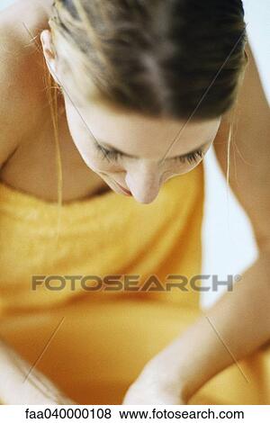 Woman washing face in bathroom sink View Large Photo Image Stock Photo - Woman washing face in bathroom sink. Fotosearch