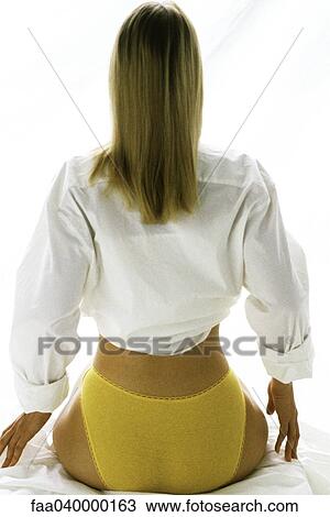 Woman wearing underwear and button down shirt, rear view View Large Photo Image Stock Image - Woman wearing underwear and button down shirt, rear view. Fotosearch