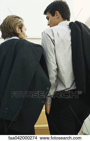 Picture - Business colleagues going up steps together. Fotosearch