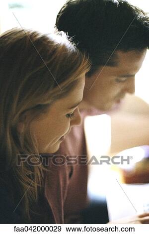 "Couple looking down, profile" View Large Photo Image Stock Photo - "Couple looking down, profile". Fotosearch